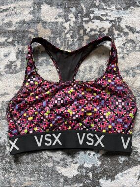 VSX Multicolor Geometric Racerback Sports Bra in Pink and Black